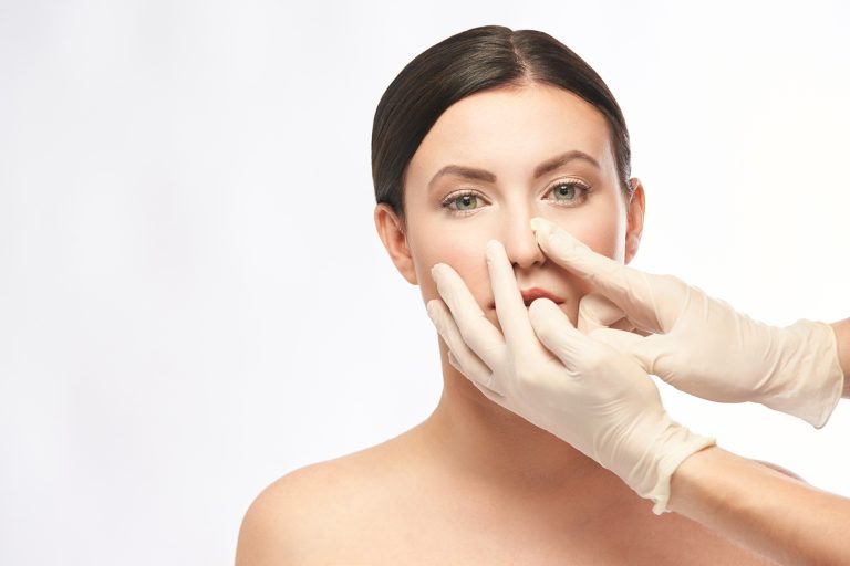 Female derma rejuvenate treatment. Doctor in glove touch woman face. Cosmetology